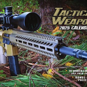 May include: A gold and black rifle with a scope and a tactical-style handguard. The rifle is lying on a bed of green leaves and branches. The text "TACTICAL WEAPONS 2025 CALENDAR" is visible at the top of the image.