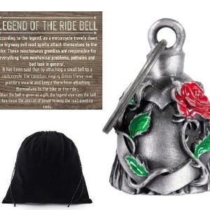 May include: A silver motorcycle ride bell with a red rose and green leaves design. Includes a black velvet pouch and a wooden sign with text about the bell's legend. The bell is a decorative accessory.