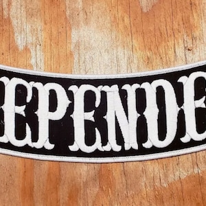 May include: Black and white motorcycle patch with the word "INDEPENDENT" in white lettering.