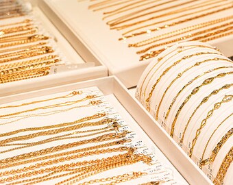 gold-chains-and-bracelets-on-jewelry-display