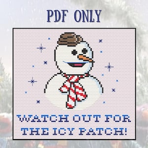 May include: A cross-stitch pattern featuring a smiling snowman wearing a red and white striped scarf and a brown hat. The text "Watch out for the icy patch!" is below the snowman.