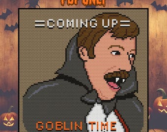 May include: Cross-stitch pattern featuring a cartoon vampire with the text "=COMING UP= GOBLIN TIME". The design is set against a tan background with Halloween-themed decorations, including pumpkins and bats.