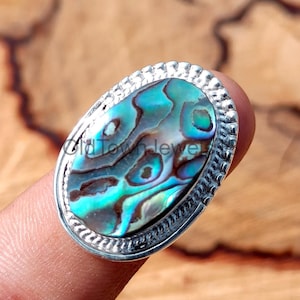 Zilveren ring met abaloneschelp