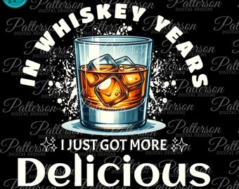 May include: A white graphic design on a black background with a glass of whiskey with ice cubes. The text reads "In whiskey years I just got more delicious".