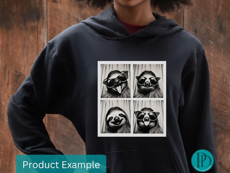 K&ouml;nnte beinhalten: Ein schwarzer Hoodie mit einem Aufdruck eines Faultiers, das eine Sonnenbrille tr&auml;gt und verschiedene Gesichtsausdr&uuml;cke macht. Der Aufdruck befindet sich in einem wei&szlig;en Rahmen.