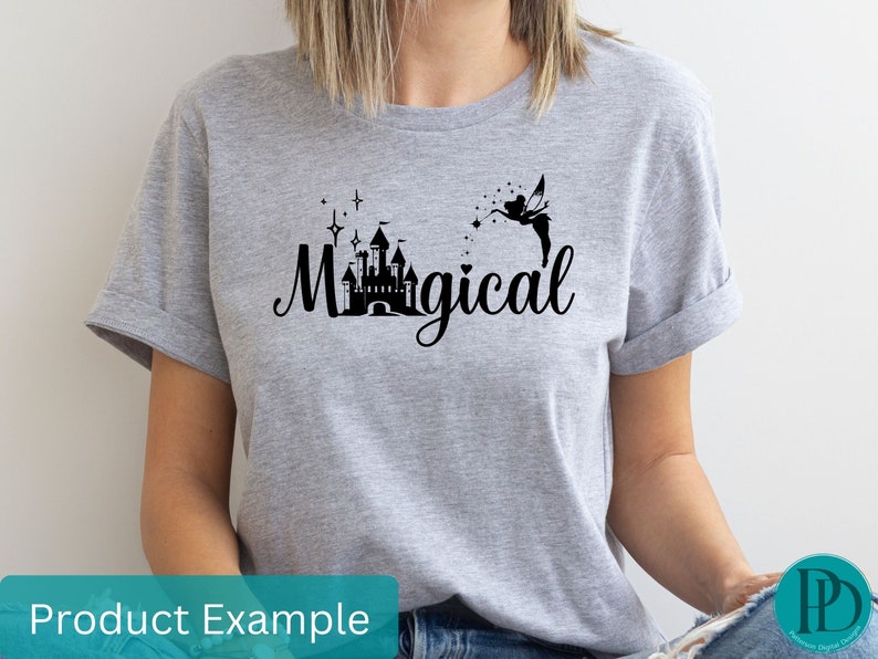 May include: A gray t-shirt with a black graphic of a castle, a fairy, and the word "Magical".