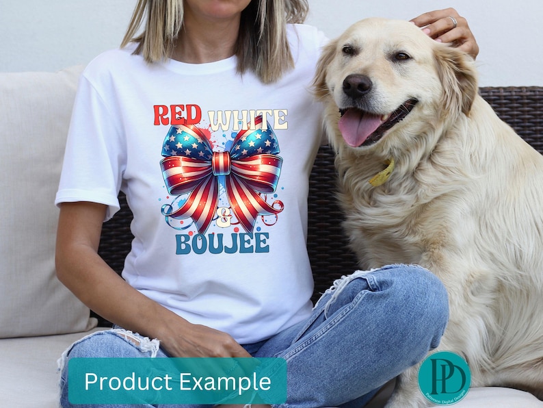 May include: White t-shirt with a patriotic bow graphic in red, white, and blue, with the words "Red White & Boujee". The shirt is worn with blue jeans. A golden retriever dog is in the image.