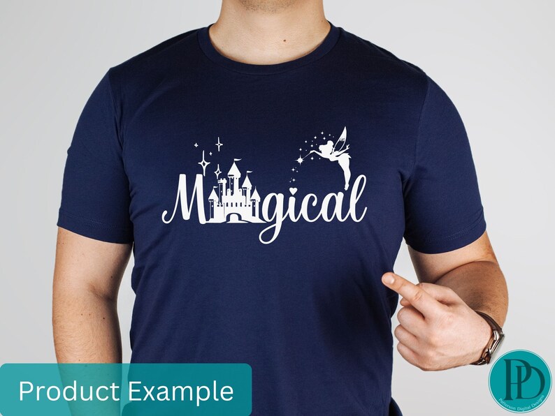 May include: A navy blue t-shirt with a white graphic design featuring a castle, stars, a fairy, and the text "Magical".