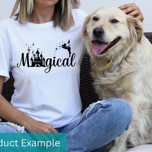 May include: White t-shirt with a black graphic of a castle and a fairy with the text "Magical".