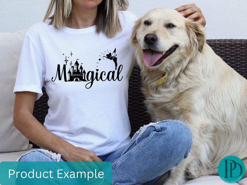 May include: White t-shirt with a black graphic of a castle and a fairy with the text "Magical".