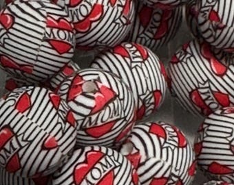 May include: A collection of round beads with a white base, black stripes, and red heart-shaped accents. Each bead features the word "MOM" in a heart design, creating a sentimental and decorative appeal.