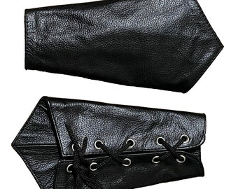 May include: Two black leather arm bands. One is plain and the other has a lace-up design with metal eyelets.