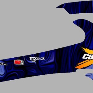 May include: Blue and purple abstract graphic design with a yellow "Can-Am Team" logo and "XMR" text.
