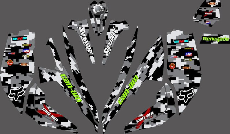 May include: A set of black and white camouflage vinyl decals for a Can-Am Renegade ATV. The decals feature the Can-Am logo, SuperATV branding, and a Fox head graphic.