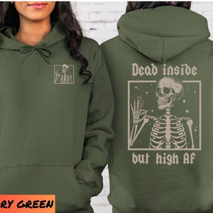 May include: A military green hoodie with a skeleton holding a joint and the text "Dead inside but high af" printed on the back.