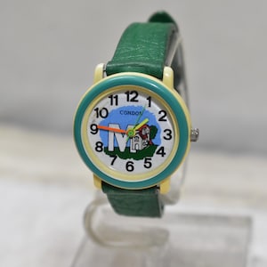 Reloj infantil Condor vintage, correa verde con esfera de dibujos animados, sin funcionamiento, de acero inoxidable y de pulsera.