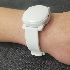 Ava fertility tracker mounted on 16mm adapter with a white silicone watch band modeled on Abby's wrist. :)