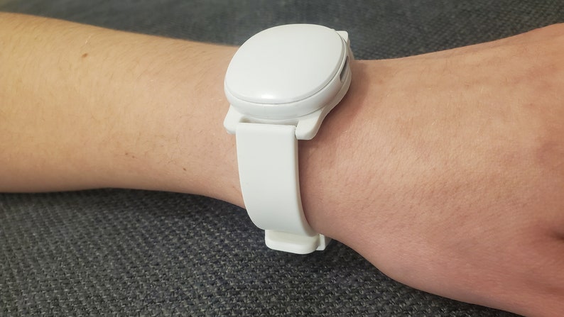 Ava fertility tracker mounted on 16mm adapter with a white silicone watch band modeled on Abby's wrist. :)