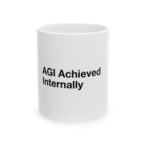 May include: A white ceramic mug featuring the black printed text AGI Achieved Internally on the front. The mug has a cylindrical shape with a smooth finish and a standard handle-less design, displaying clear black lettering against the white surface.