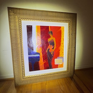 May include: A white ceramic mug with a black handle and the text "But First, Coffee" in a black, bold font. The mug is sitting on a wooden surface. The mug is approximately 4 inches tall.