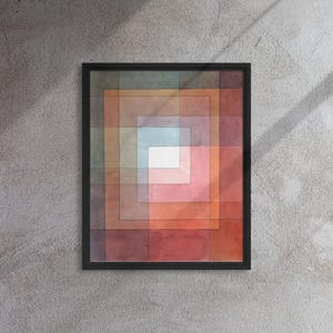 Op de afbeelding: Abstract aquarel schilderij in een zwart frame. Het schilderij toont een reeks concentrische vierkanten in tinten rood, oranje, roze, blauw en groen.