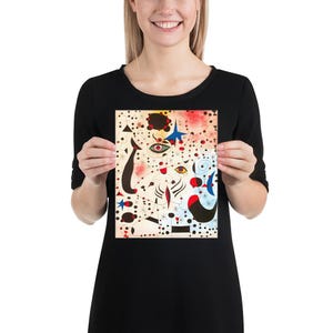 May include: Abstract art print featuring a colorful, whimsical design with black, white, red, blue, and yellow shapes. The print has a white background with a black outline and a variety of geometric shapes.