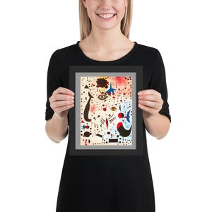 May include: Framed print of a colourful abstract painting with geometric shapes, eyes, and a star. The background is white with black dots.