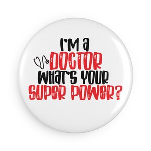 May include: White button with black text that reads "I'm a doctor what's your superpower?" with a red stethoscope graphic.