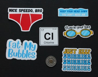 May include: A set of nine swimming-themed stickers. The stickers feature phrases like "Nice Speedo, Bro", "Keep Your Head Down You Don't Need Air", "Stay in Your Lane", "Eat My Bubbles", and "Just Keep Swimming". There is also a sticker of a pair of goggles and a sticker of the chemical element chlorine.
