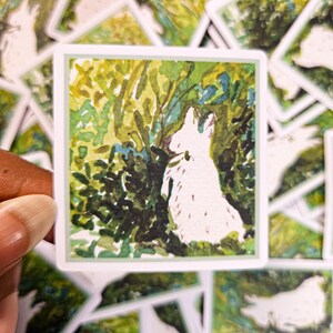 May include: A white rabbit is painted in a watercolor style, standing in a green and yellow forest. The rabbit is facing to the right and is surrounded by green foliage.