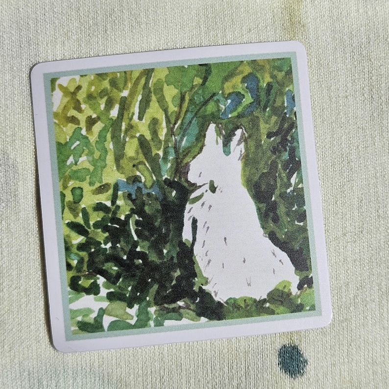 May include: A watercolor painting of a white rabbit sitting in a green bush. The rabbit is facing away from the viewer and has its head turned to the side. The bush is made up of green leaves and branches.
