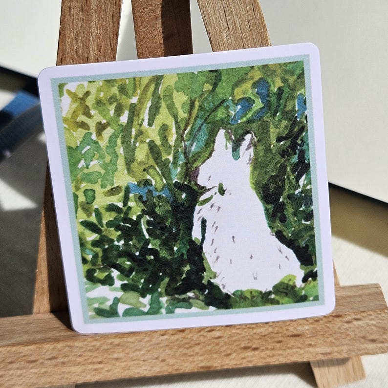 May include: A watercolor painting of a white rabbit sitting in a green bush. The rabbit is facing away from the viewer and has its head tilted up. The bush is made up of many small green leaves.