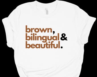 May include: White t-shirt with the text "brown, bilingual & beautiful." printed in brown and black.