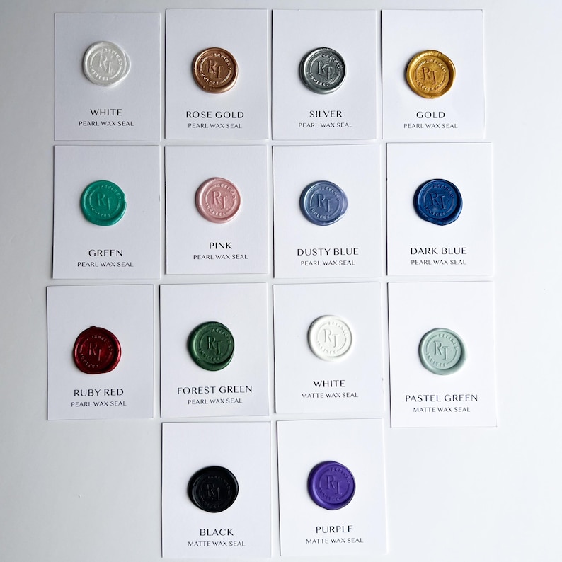 May include: An assortment of pearl and matte wax seals in various colors, including white, rose gold, silver, gold, green, pink, dusty blue, dark blue, ruby red, forest green, black, pastel green, and purple. Each seal is on a white card with text.