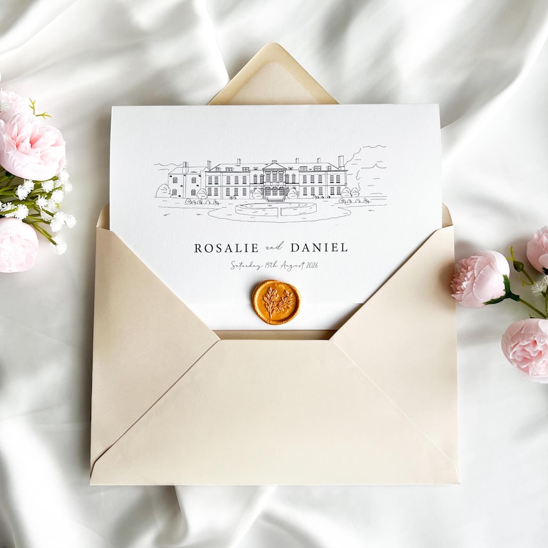 May include: Wedding invitation featuring a black and white line drawing of a stately building, with the names "Rosalie and Daniel" and the date "Saturday 15th August 2026" printed below. The invitation is inside a cream-colored envelope, sealed with a gold wax stamp.