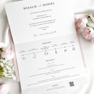 May include: A formal wedding invitation with the names Rosalie and Daniel at the top. The invitation includes the date, time, and location of the ceremony, along with a detailed schedule of events and RSVP information.