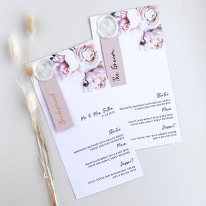 May include: Wedding stationery featuring floral designs and menu details. The menus include the names "Mr. & Mrs. Sutton" and the date "27.03.2024". The menus are accented with wax seals and the words "Bridesmaid" and "The Groom".