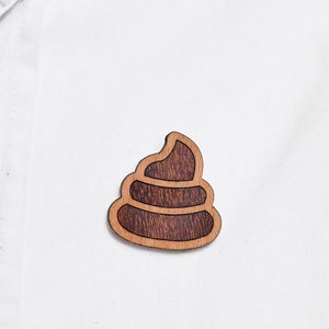 Piles of excrement as a pin, badge, brooch made of wood for a celebration or festival image 2