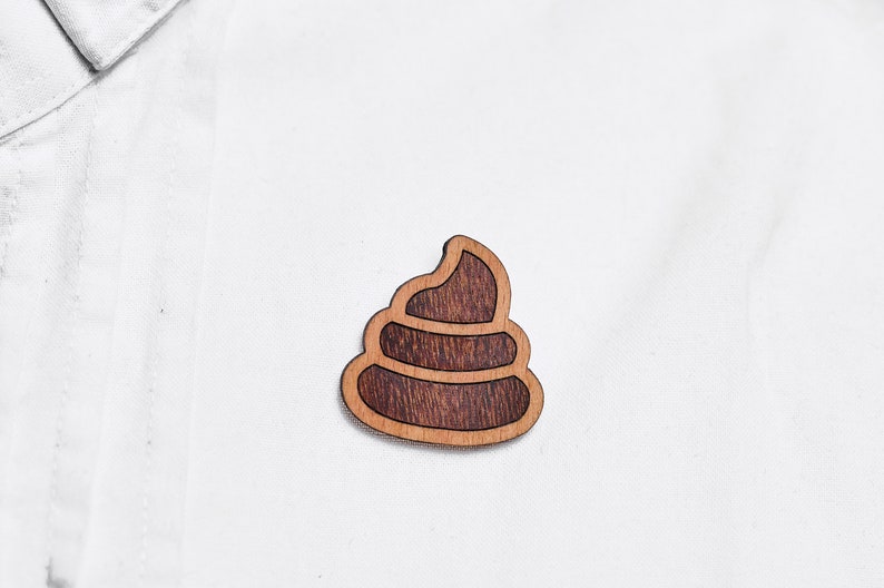 Piles of excrement as a pin, badge, brooch made of wood for a celebration or festival image 2