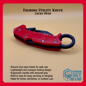 May include: A red and black folding utility knife with the text "FOLDING UTILITY KNIFE LOCKS OPEN". The knife has a textured grip and a built-in loop. The blade locks open for safe use. The knife is lightweight and compact.