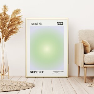 May include: A gold framed poster with a light green and purple gradient background. The poster has the text "Angel No. 333 SUPPORT Your Spiritual Guides Are With You."