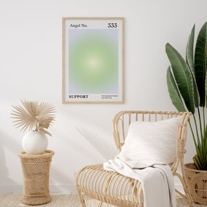 May include: A framed print with a gradient background in shades of purple, green, and white. The print has the text "Angel No. 333" at the top and "SUPPORT Your Spiritual Guides Are With You" at the bottom.