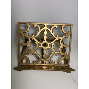 Soporte para libros vintage de latón macizo, ajustable, con filigrana decorativa, estilo MCM.