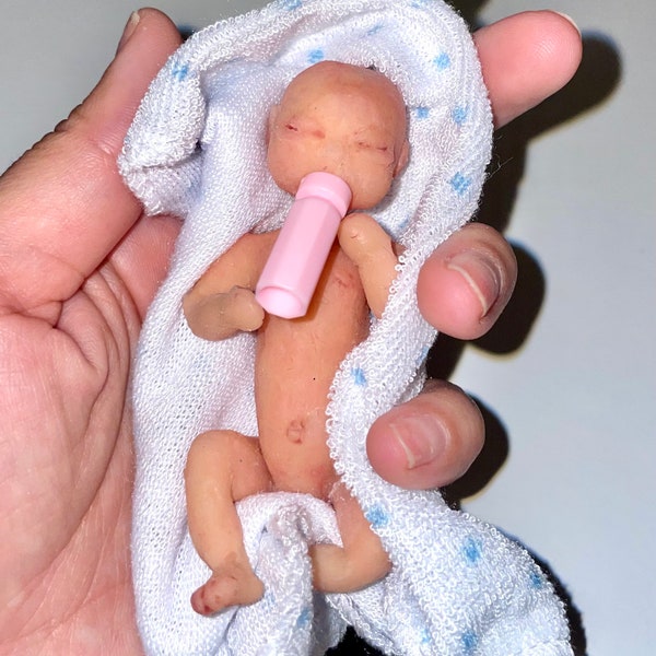 Mini full body silicone baby doll