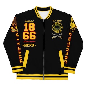 May include: Black bomber jacket with yellow and red accents. The jacket features the text "Established 1866 American *HERO*" on the left side and "U.S. ARMY 1866-1951 9TH CAVALRY TOP WE WILL" on the right side.