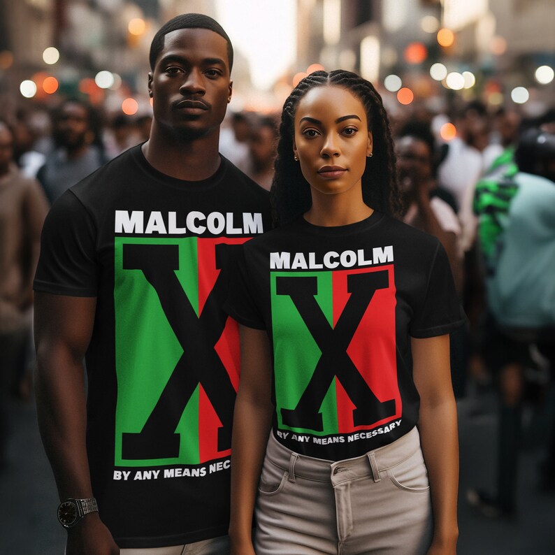 May include: Two people wearing black t-shirts with a graphic of a red, green, and black "X" and the text "Malcolm X" and "By Any Means Necessary".