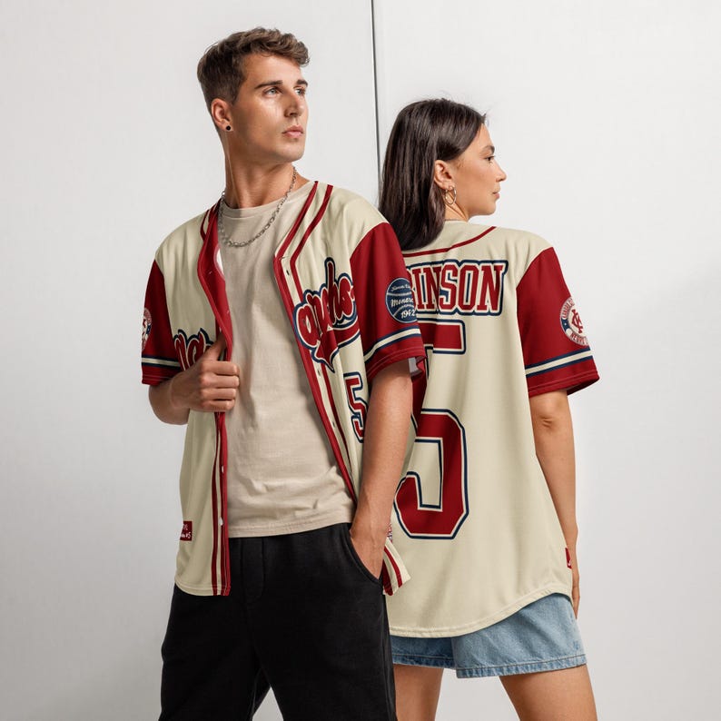 Models wearing vintage style Jackie Robinson baseball jersey at a baseball field