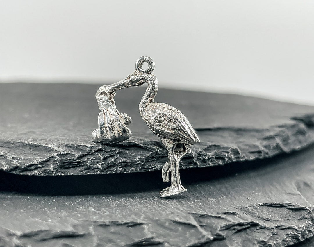 Pendentif Cigogne et bébé, Or jaune
