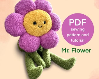 May include: A plush purple flower with a yellow face and green legs. The flower is smiling and has two black eyes. The text "PDF sewing pattern and tutorial Mr. Flower" is on the image.