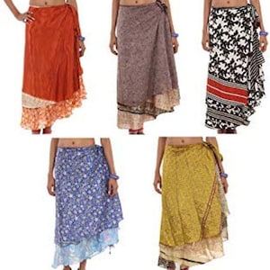 May include: Five wrap skirts in various colors and patterns. The top row features a solid orange skirt with a floral hem, a grey patterned skirt, and a black and white floral skirt with a red stripe. The bottom row shows a blue floral skirt and a yellow patterned skirt.